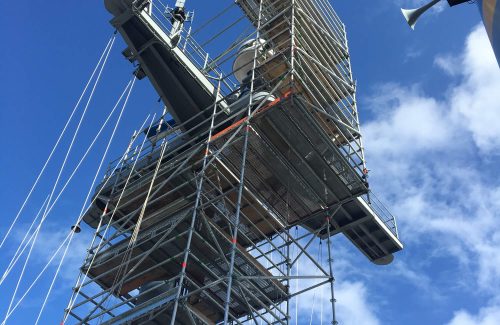 tall scaffold set up with a blue sky background