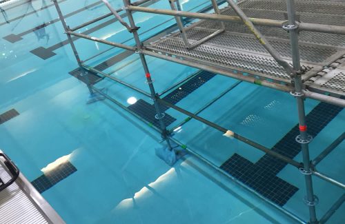 scaffold inside of a pool with water