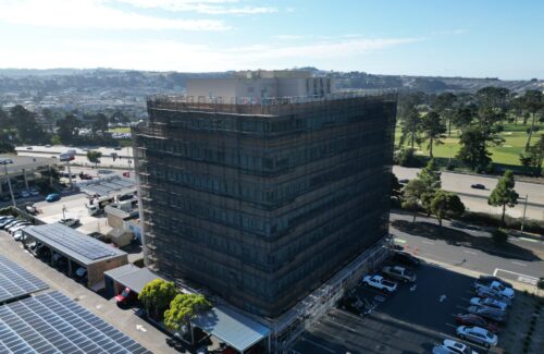 aerial view of daly city full building scaffolding