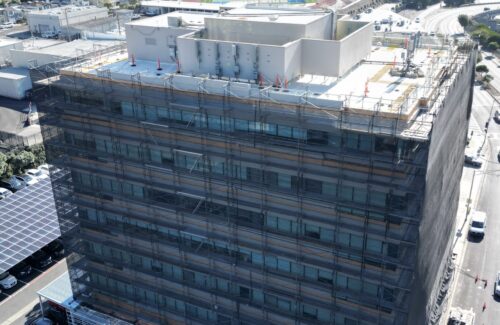 aerial photo of scaffolding a whole building in Daly city