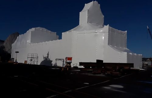 white shrink wrap covering a large building