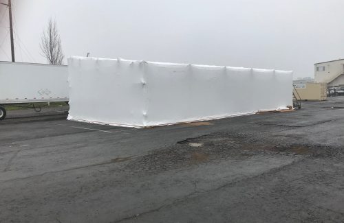 white shrink wrapping done on a rectangular structure
